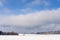 Field under snow by forest near Kostelec nad Cernymi Lesy