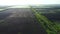 Fields in early spring summer morning from great height.