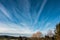 Fields, meadows, forests and white clouds in the blue sky