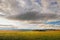 Fields and open spaces in the steppes of Tuva against the background of sunset