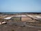 The fields for salt mining on the banks of the Atlantic Ocean. Blue horizon, turquoise water. Lanzarote