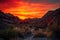 fiery canyon sunsets, with silhouette of rugged mountain range in the background