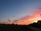 Fiery clouds in the rays of the setting sun