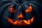 Fiery devilish smile lantern jack pumpkin big close-up in the dark decor halloween