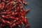 Fiery flavor. High angle shot of dried red chillies on a kitchen counter.