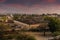 A fiery night sky at sunset over the roof tops of Mandawa, Rajasthan, India