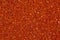 Fiery orange background with bright glitter. Can be used as texture in art projects.
