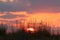 Fiery red illumination of the sky above the horizon at sunset