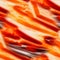 A fiery seamless abstraction with streams of incandescent lava. Orange textures resembling burning streams