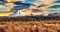 Fiery skies over the snow capped peaks in the desert Road