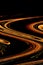 Fiery spirals of curvature of space on a black background