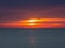Fiery sunrise at the sea. Summer season. Emilia Romagna region. Adriatic sea. Italy
