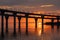 Fiery sunset on Kanonersky Island in St. Petersburg. Western high-speed diameter. Automobile bridge. The Gulf of Finland. Orange