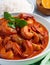 Fiery Temptation: Close-Up of Spicy Shrimp Curry on a White Background. AI Generated