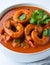 Fiery Temptation: Close-Up of Spicy Shrimp Curry on a White Background. AI Generated