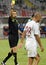 FIFA Referee Alexandru Tudor shows a Yellow card