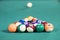 Fifteen billiard balls on the pool table