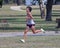 Fifteen-year-old Amerasian boy running a five kilometer 5K cross country race at Eldon Lyon Park in Bethany, Oklahoma.