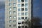 Fifties high rise residential building reflected in new glass ar