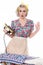 Fifties housewife pressing clothes with vintage iron, humorous c