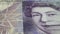 Fifty British Pound paper banknote in close up macro view dolly shot.