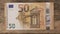 Fifty euro banknote with old vintage key. Money opens many doors. Ancient key on banknotes