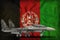 Fighter, interceptor with city camouflage on the Afghanistan state flag background. 3d Illustration