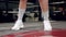 Fighter woman fist close up - boxer strikes into the side of the camcorder. Spectator video boxing.