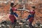 Fighters take part in an outdoor ancient Thai fencing.