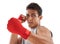 Fighting fierce. Portrait of a handsome young kick-boxer punching against a white background.