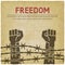 Fighting for freedom concept. Hands clenched into fist behind barbed wire vintage background