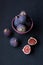 Figs in a plate on a black background