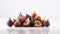 Figs: a tantalizing display of half and whole fruits, glistening with freshness