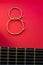figure eight of guitar strings on a red background. guitar neck