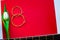 figure eight of guitar strings on a red background. guitar neck