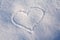 Figure of eight written in the snow in the painted heart