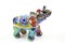 The figure of an elephant made of ceramics is decorated with colored mother-of-pearl paints turquoise purple silver Inserts of col