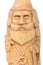 The figure of the good Wizard carved from beech with a staff and a scroll in hands. Old decorative toy. Portrait.