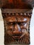 Figure head lion carved in wood in the corner