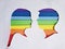 figure of male and female human faces of profile with the colors of the rainbow and the white background