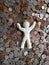 figure of a person resting in money, made with white clay and background with dollar pennies