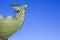 Figure of Siren on Rostral Ð¡olumn on Spit of Vasilievsky Island in St. Petersburg against background of blue sky, Rus