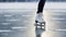 a figure skater skates across a frozen lake, figure skater on frozen lake, frozen background