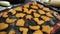 Figured Christmas cookies lie on baking sheet on a table