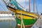 Figurehead of a sailing boat in a port in sunlight