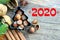 Figures 2020 Christmas composition. Background New year, Christmas. Hazelnuts in the shape of a Christmas tree on a wooden antique