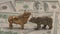 Figures of a bull and a bear on the background of paper money