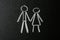 Figures of man and woman drawn on blackboard