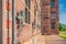 figures of prominent Danes on a red brick facade of Rosenborg royal Castle in Copenhagen, Denmark