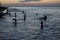 Figures at sunset in Stone Town Zanzibar,